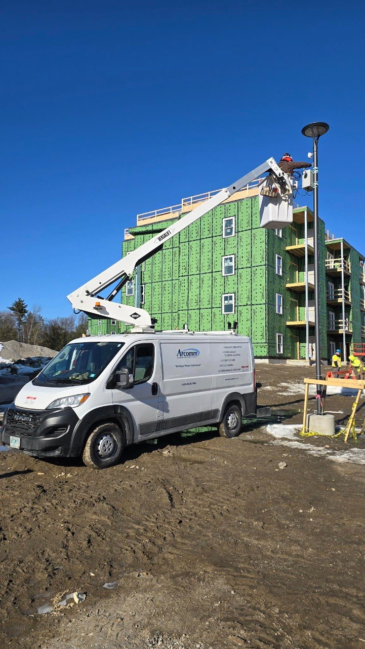 Alarm System Installation NH | Commercial Security Alarm | Arcomm 3 Arcomm Bucket Truck On Commercial Job Site In New Hampshire